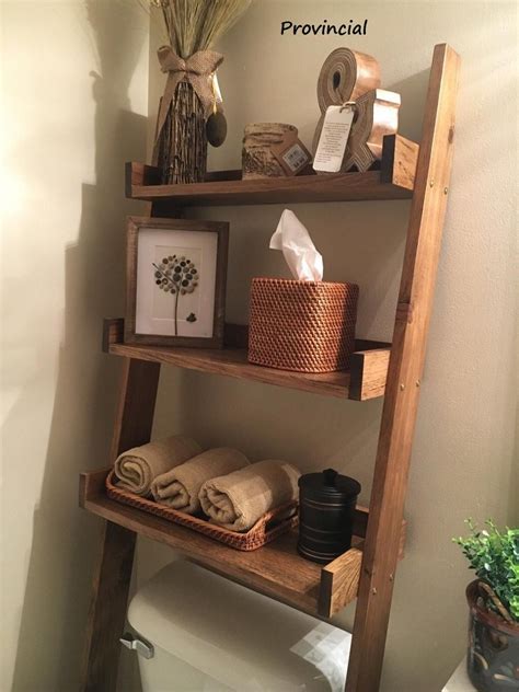 The issue is the toilet is not centered on the wall. Over the Toilet Ladder Shelf | Etsy | Small bathroom decor ...