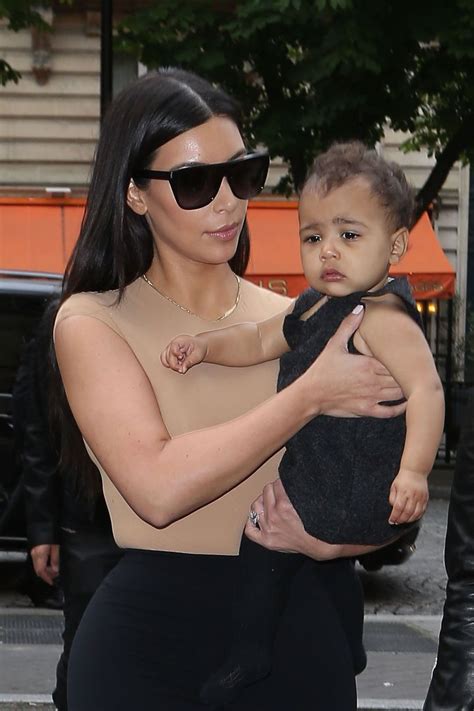 10 Cutest Pics Of Kim Kardashian Carrying North West Photos Hot 107