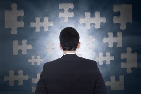 Businessman Figuring Out Puzzle Pieces Stock Image Image Of Graphic
