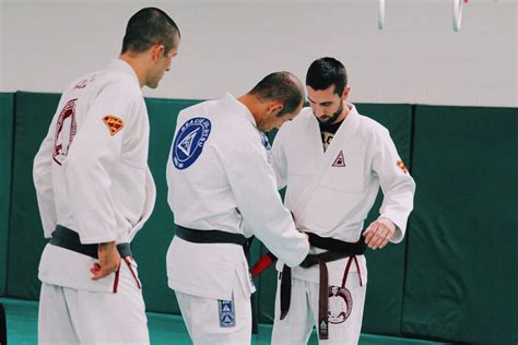 Chris Light Receiving Jiu Jitsu Black Belt From Ryron And Rener Gracie In