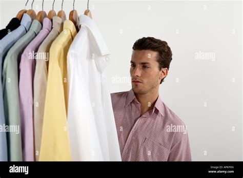 Young Man With Clothing Rack Stock Photo Alamy