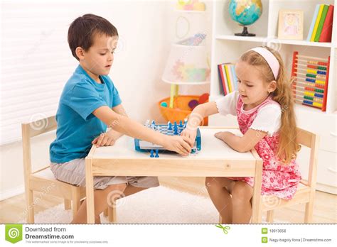 Siblings Playing Chess In The Kid S Room Stock Photo Image Of