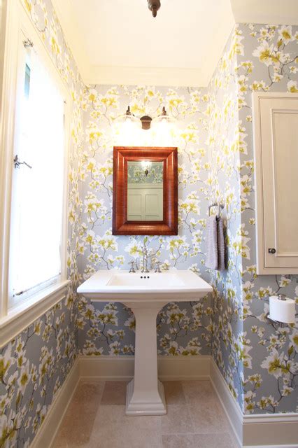 Pedestal Sink With Wood Toned Mirror Above On Wallpapered Wall