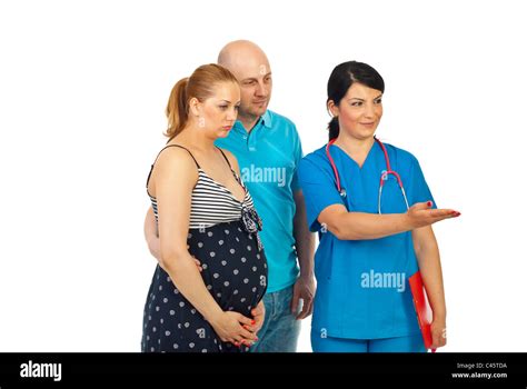Doctor Woman Invite To Join Or Showing Something To A Pregnant Couple