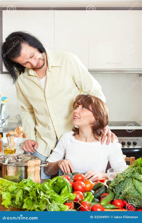 Beautiful Housewife With Man Cooking With Fresh Vegetables In Kitchen Stock Image Image Of