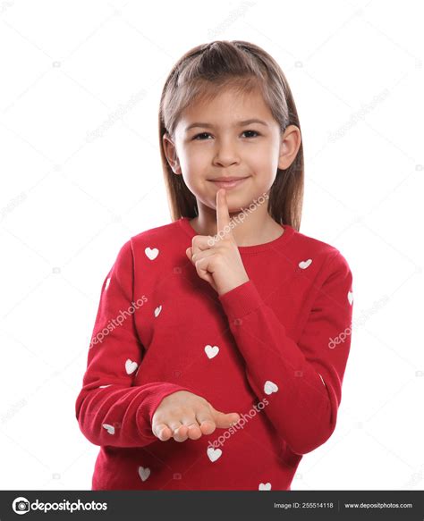 Little Girl Showing Hush Gesture In Sign Language On White Background
