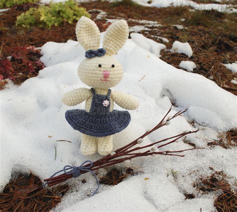 Easter Bunny With A Branch Of Willow In The Snow Forest Stock Image