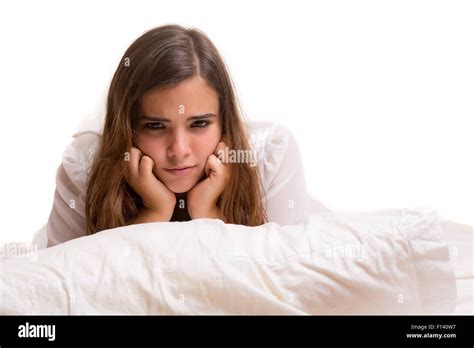 Depressed Woman Lying In Bed Isolated Over White Stock Photo Alamy