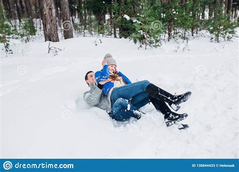 Happy Couple Having Fun Outdoors In Snow Park Winter Vacation Stock