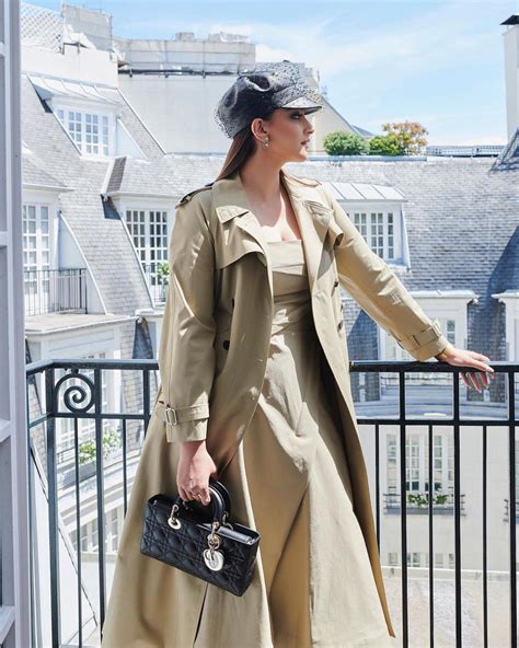 in pics sonam kapoor glams up in trench coat dress for dior s autumn winter show in paris