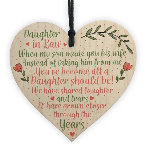 A gift from her favorite line of clothing, purse designer or shoe manufacturer. Daughter In Law Birthday Christmas GIFTS Wooden Heart Plaque