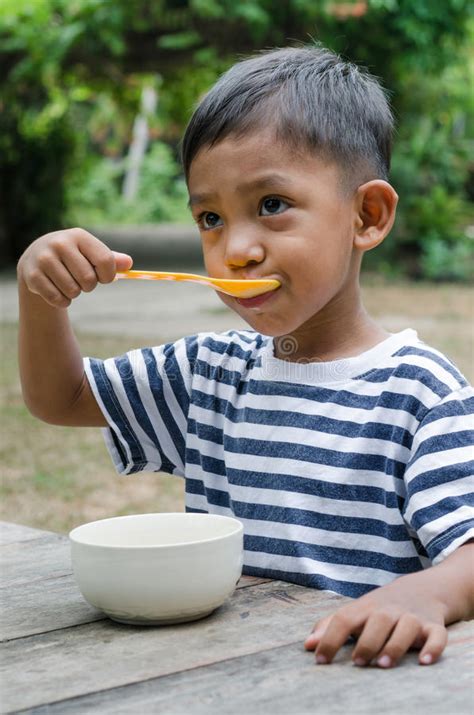 Asian Child Eating the Breakfast. Stock Photo - Image of enjoy, life ...