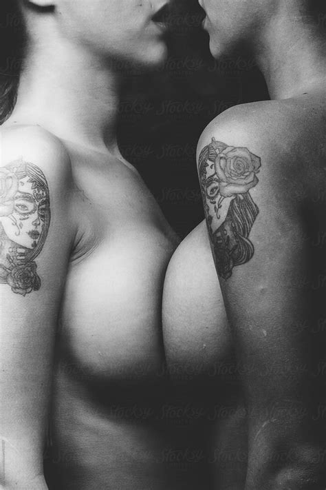Tattoo And Breast Beautiful Tattooed Girl In Front Of Mirror Del Colaborador De Stocksy Igor