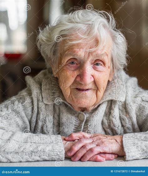 Very Old Woman Standing Holding Cane Royalty Free Stock Image