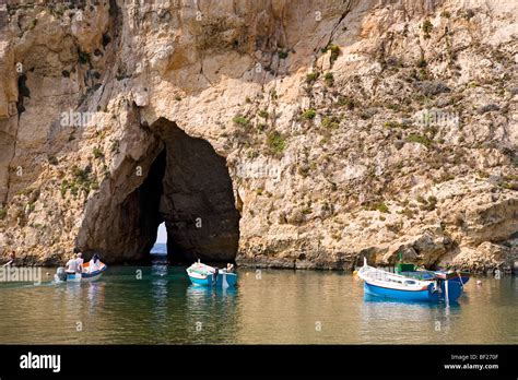 Boats On Dwejra Lake In Front Of A Cave Gozo Malta Europe Stock