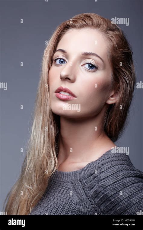 Portrait Of Young Woman In Gray Woolen Sweater Beautiful Girl Posing