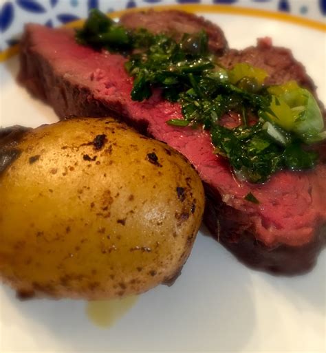 Toss potatoes with 1 tablespoon oil and rosemary on a rimmed baking sheet; Beef tenderloin with smoky potatoes and persillade relish ...