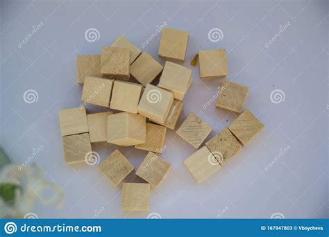 Pile Of Wooden Blocks On Pale Purple Background Small