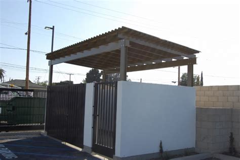 Raccoons have been tipping our trash for years, that is why we purchased our first outdoor wooden garbage can storage bin enclosure from bearicuda. Fusion Metalworks - Trash Enclosure Gates