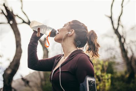 Woman Drinking Water After A Running Exercise Stock Image Image Of
