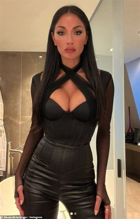 nicole scherzinger puts on a very busty display in a plunging corset