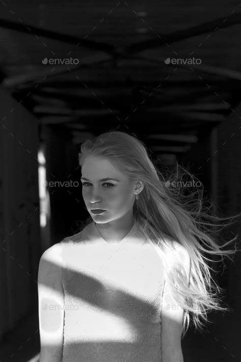 Beautiful Blonde Girl In A Pedestrian Tunnel Brooding And Mysterious