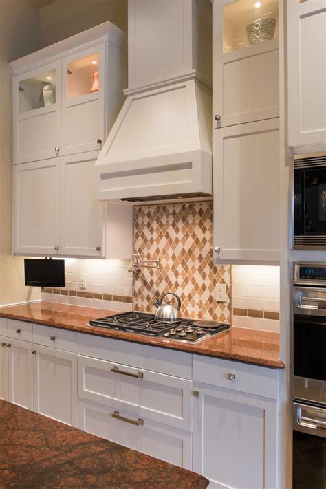 White Shaker Cabinets And Range Hood In Transitional Kitchen Hgtv