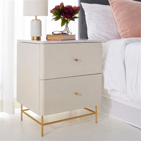 The two drawers are equipped with a blum dividing system. #nightstanddecor in 2020 | White and gold nightstand ...