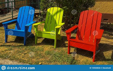 The songmics stool is a great alternative if you're on a budget. Three Empty Colourful Wooden Chairs Sitting On The Lawn ...