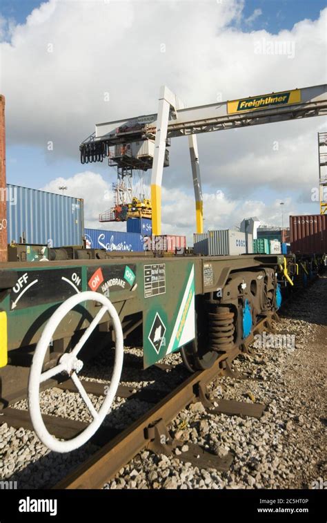 Rail Mounted Crane Being Used To Load And Unload Shipping Containers At