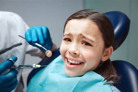 Scared Girl Sit In Dental Chair In Room She Afraid Of Dentist And