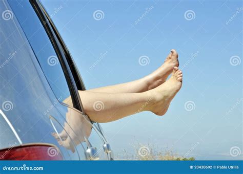 Women With Bare Feet Out The Window Of The Car Stock Photo Image Of