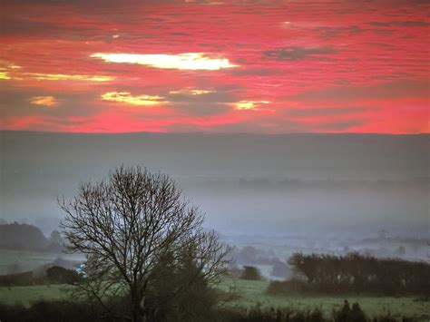 Misty Morning Sunrise Over Western Ireland Photograph By James Truett