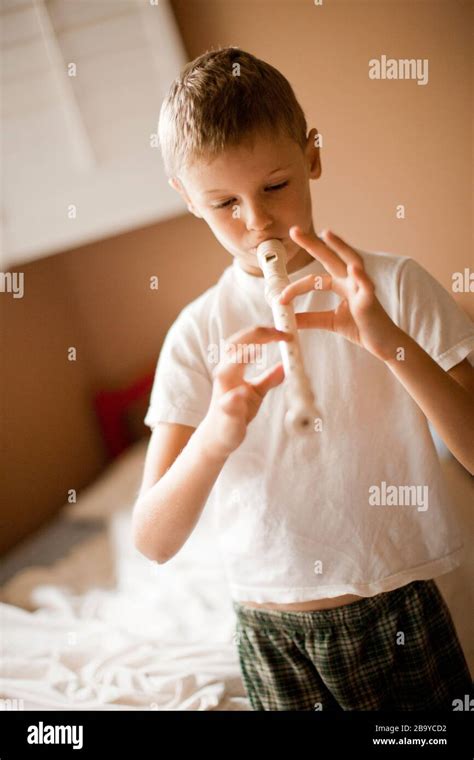 Boy Playing The Recorder Stock Photo Alamy