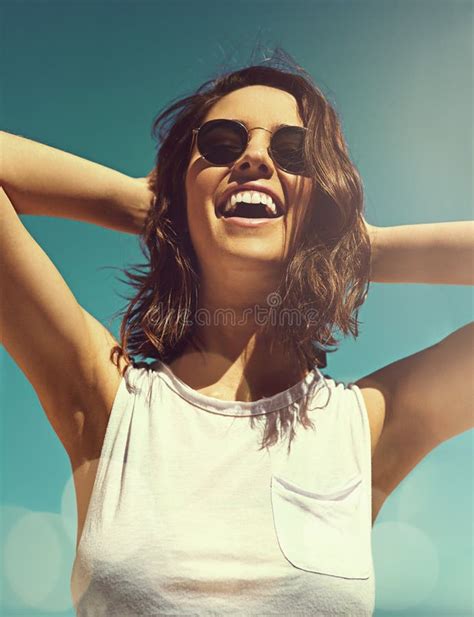 Nothing Makes Me Feel Happier Than The Sun An Attractive Young Woman Enjoying A Day On The