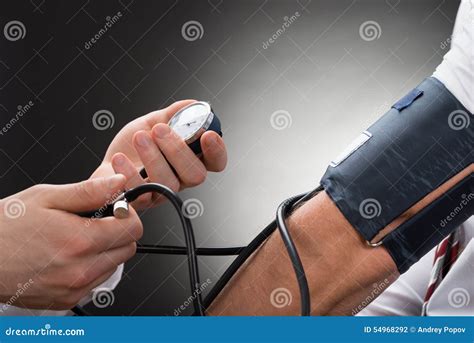 Doctor Checking Blood Pressure Of A Patient Stock Photo Image Of