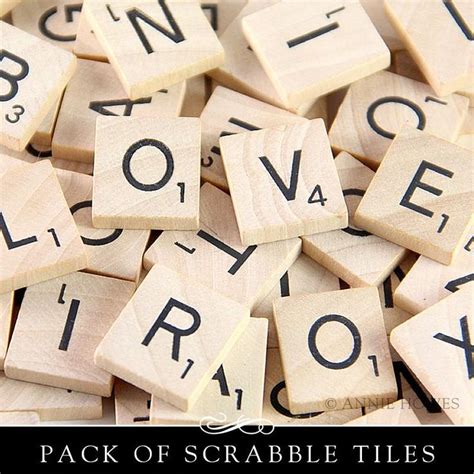 Several Scrabble Tiles With The Words Love Spelled On Them In Black And