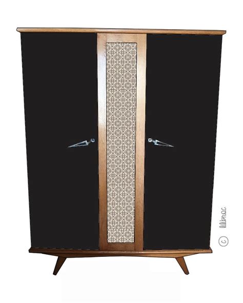 An Armoire With Two Doors And Some Handles