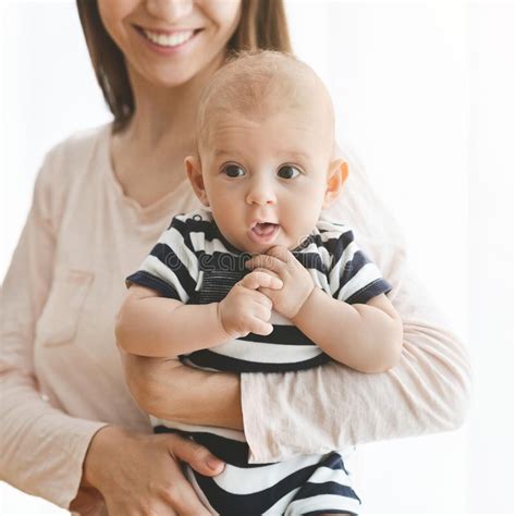 348 Happy Mother Holding Cute Smiling Curious Baby Stock Photos Free