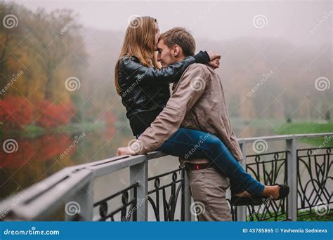 Young Couple Kissing In Autumn Park Stock Image Image Of Lifestyle