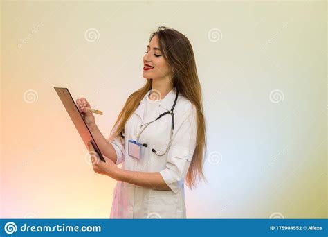 Doctor Holding Clipboard With Pen Pretty Woman In Medical Form Smiling