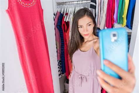 Smartphone Selfie Asian Woman In Clothes Closet Of Home Bedroom Or