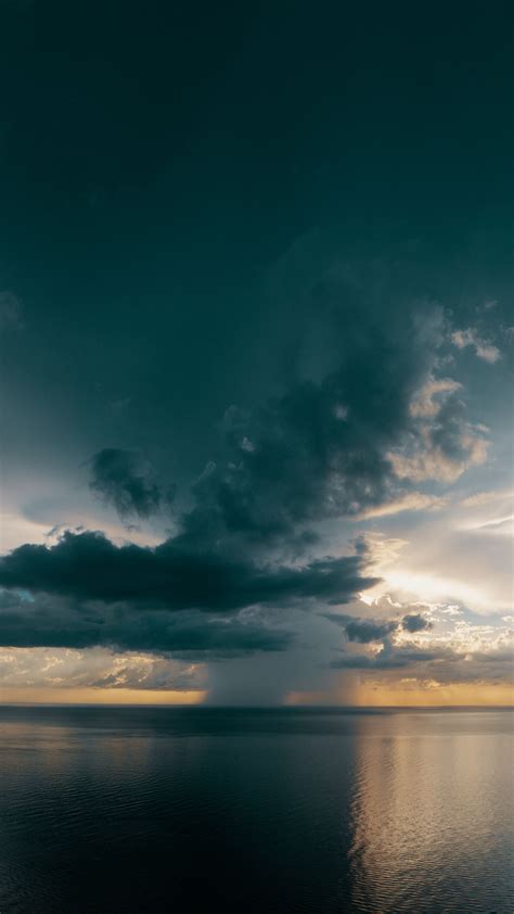 Download Wallpaper 2160x3840 Sea Horizon Clouds Ripples Overcast