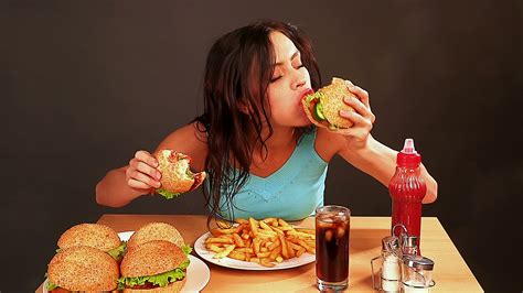 Woman Eating Junk Food Johnson Fitness And Wellness