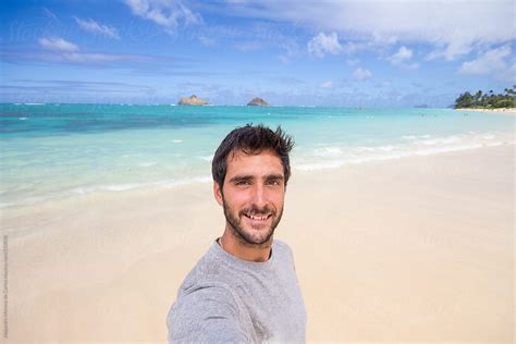 Young Man Selfie On Exotic Tropical Beach By Alejandro Moreno De Carlos Stocksy United