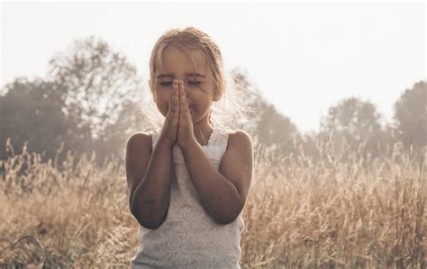 Premium Photo Little Girl Closed Her Eyes Praying Outdoors Hands