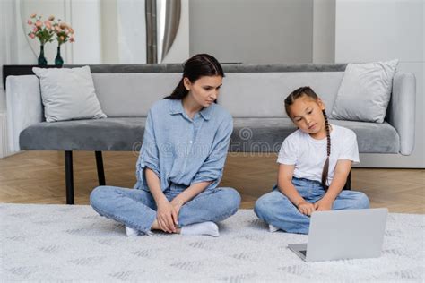 mother and asian daughter watching film stock image image of casual laptop 265874721