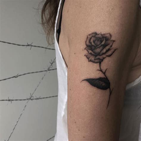 Black Rose Tattoo On The Right Upper Arm