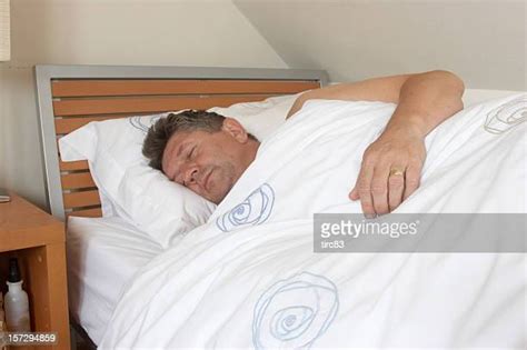 Overweight Man Sleeping In Bed Stock Fotos Und Bilder Getty Images