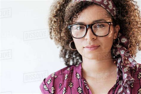 Portrait Of Smiling Woman With Curly Hair Stock Photo Dissolve